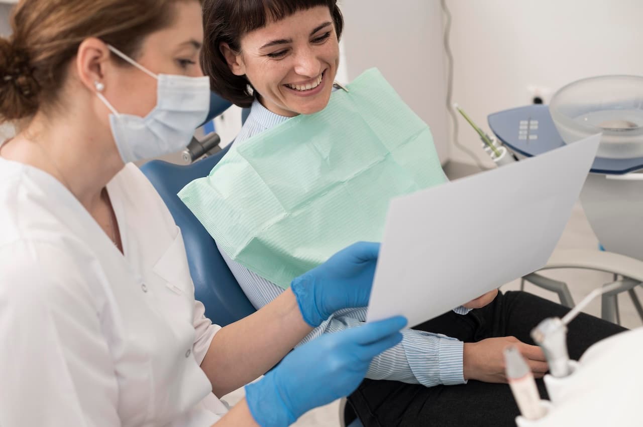 Dental practice team reviewing patient estimates